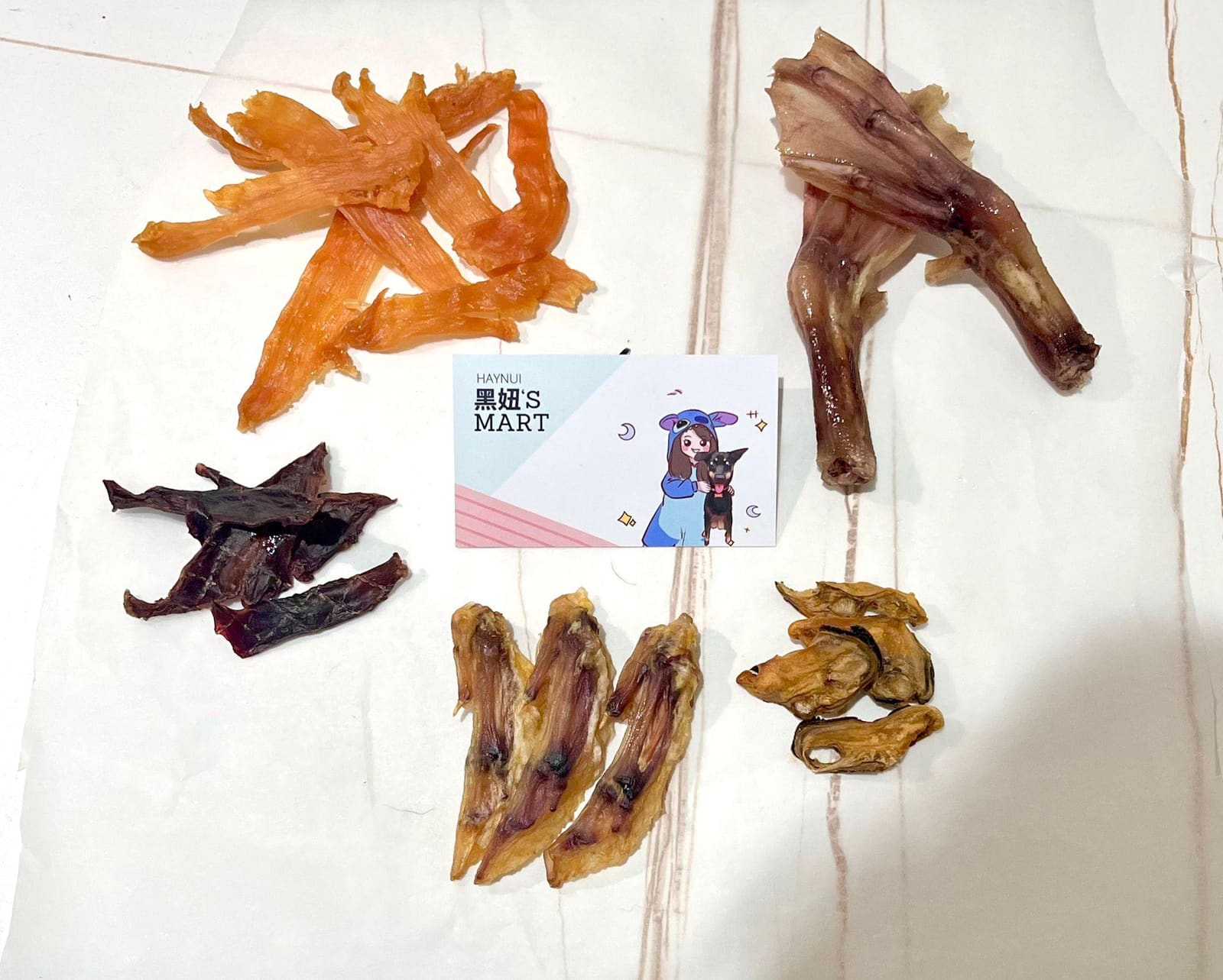 Five dried treats laid out around the name card