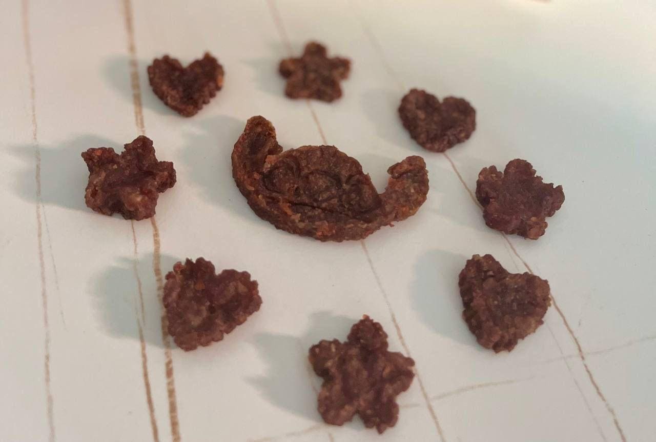 Brown meaty bites cut as hearts and flowers